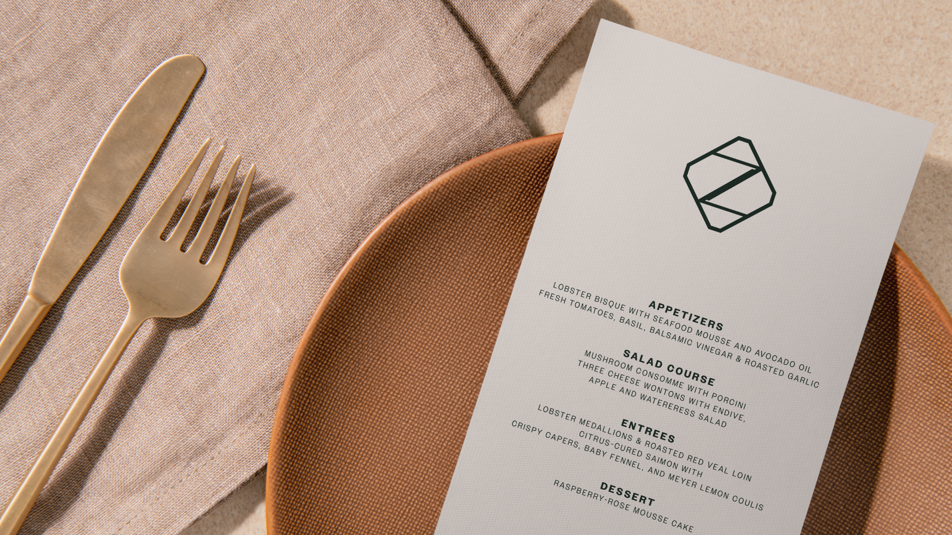 Zaylu Resort menu with the geometric monogram, displayed on a plate beside cutlery.