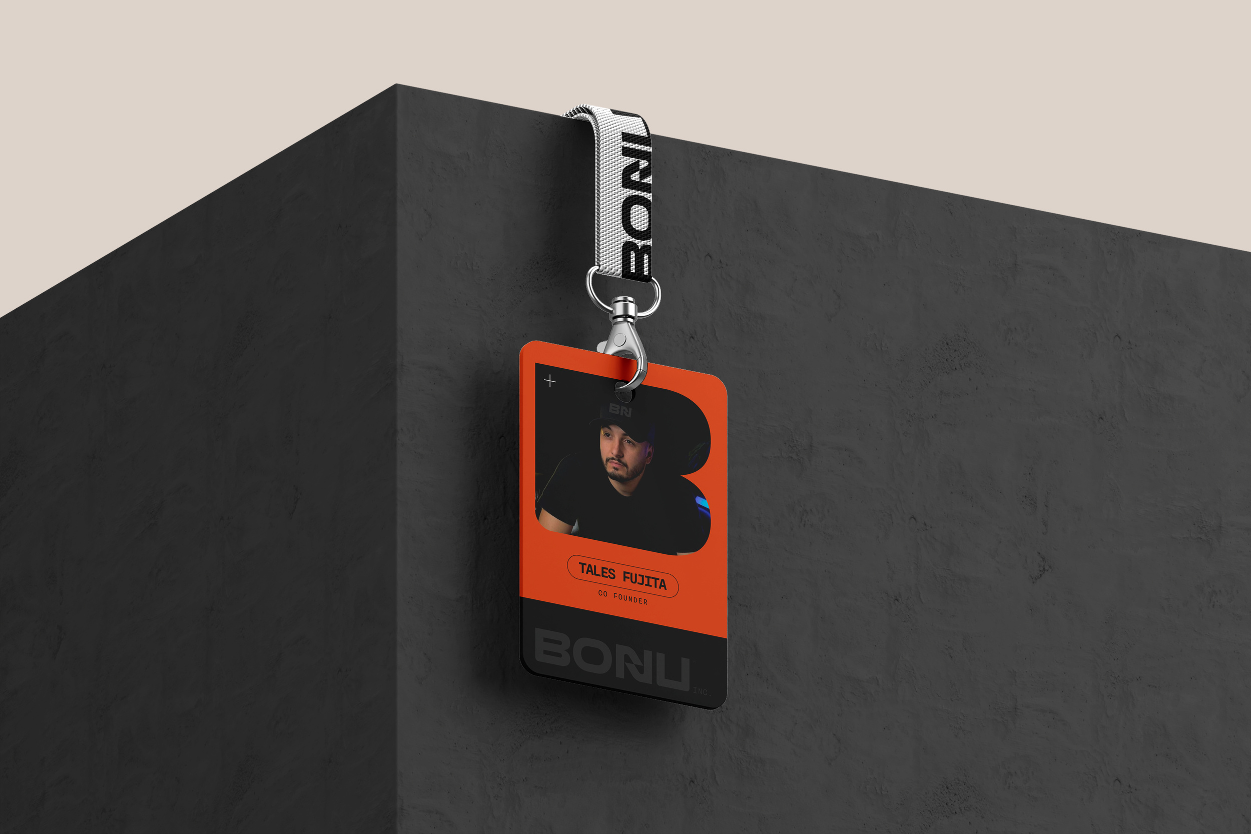 Bonu identity applied to an orange and black staff badge and branded lanyard