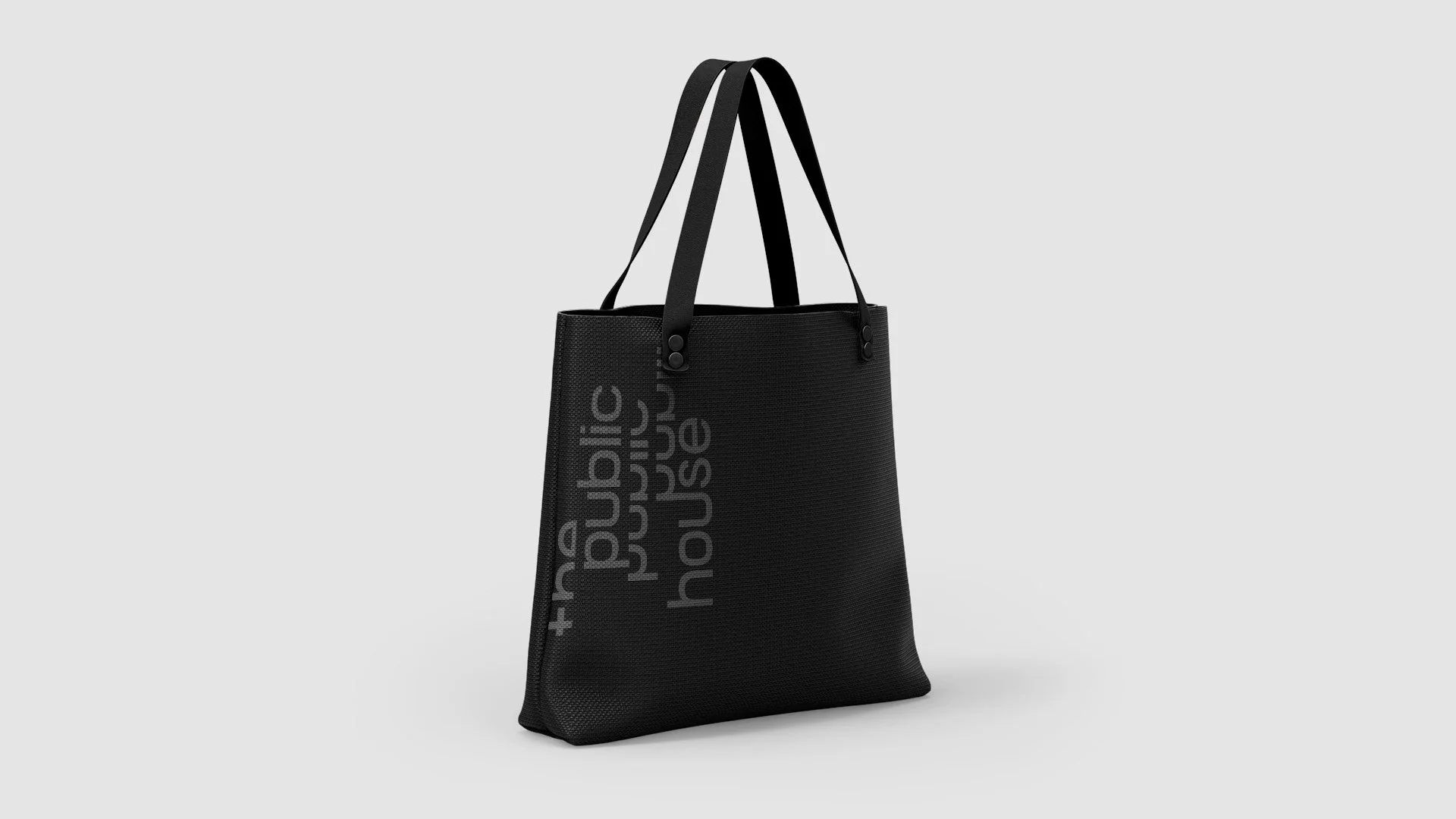 Black tote bag with The Public House wordmark