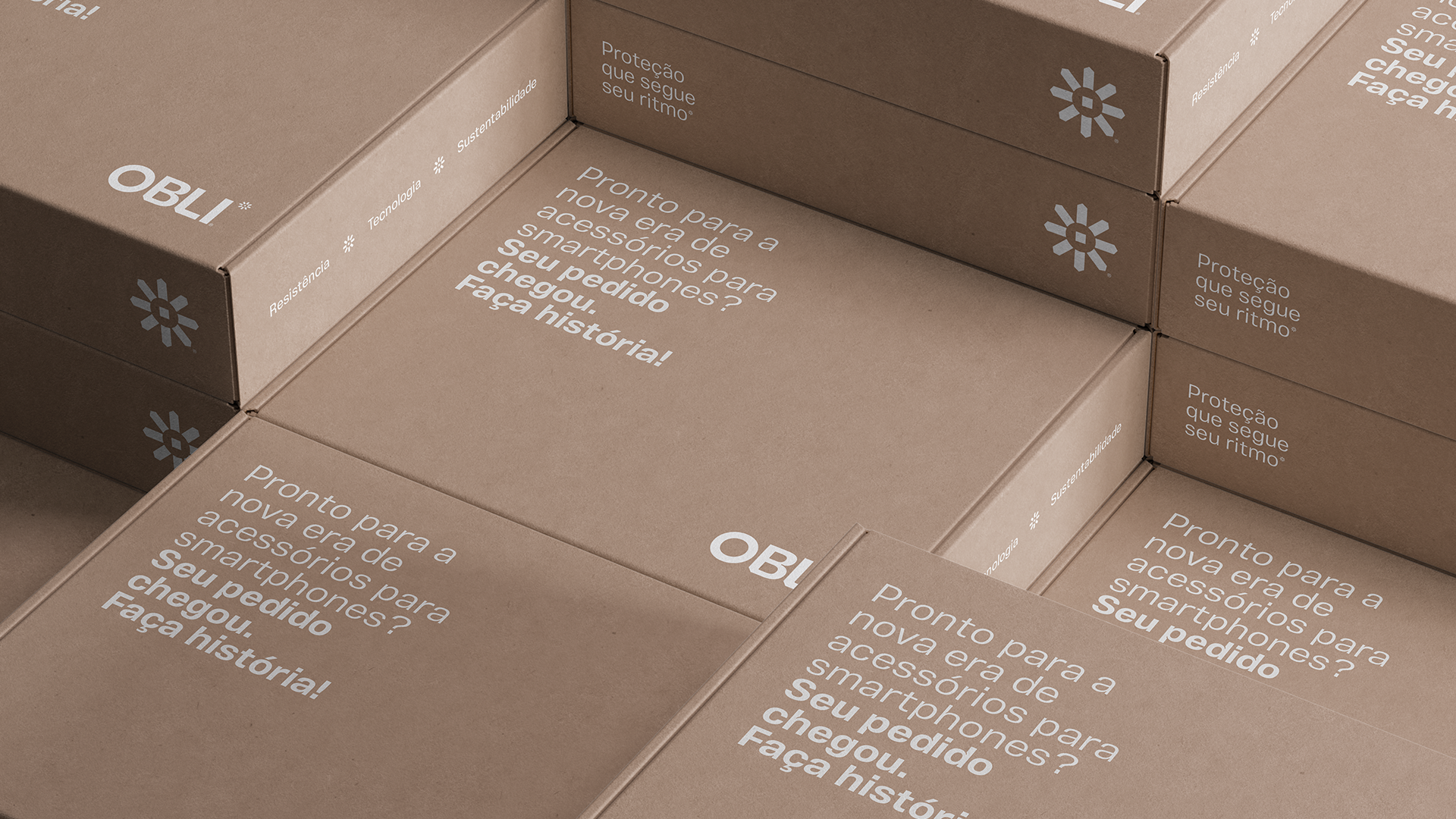 Obli kraft shipping boxes arranged in a grid, featuring the white logo, geometric symbol and printed welcome message.