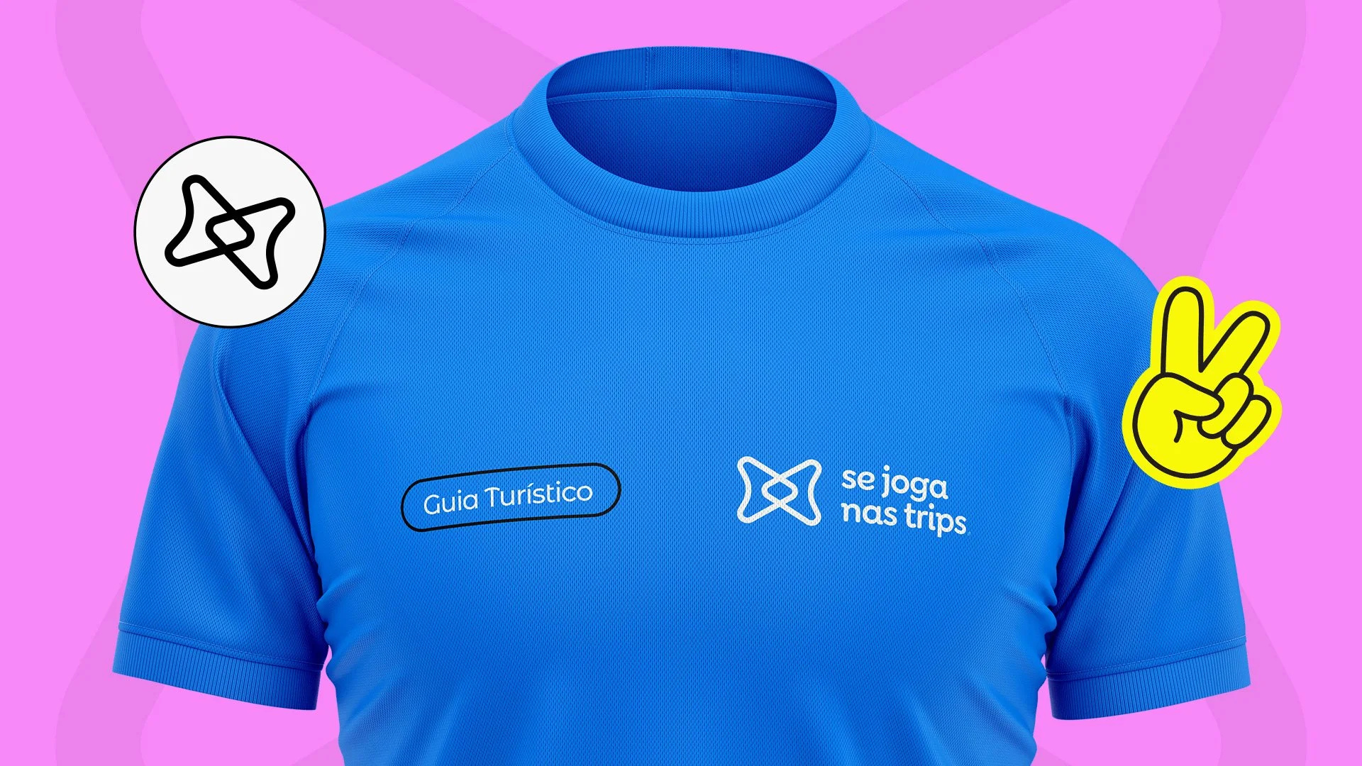 Se Joga Nas Trips blue tour guide T-shirt with the white brand wordmark, shown on a pink background with graphic stickers.